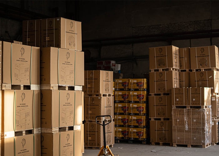 Dozens of boxes of generators in a warehouse